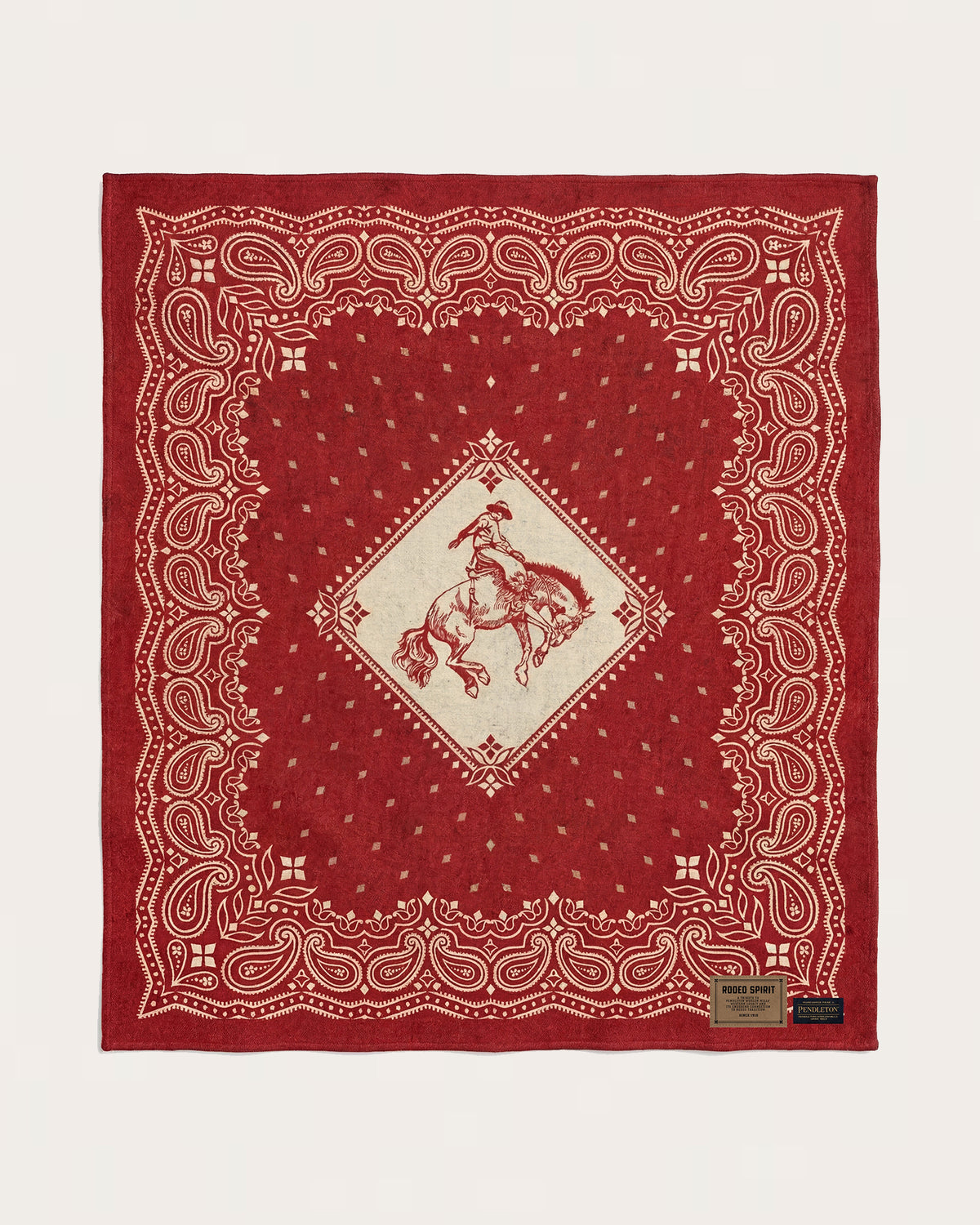 JACQUARD UNNAPPED THROW<br>RODEO SPIRIT RED