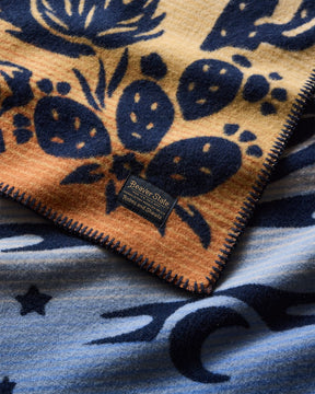 DESERT DREAM CRIB BLANKET<br>BLUE/GOLD MULTI