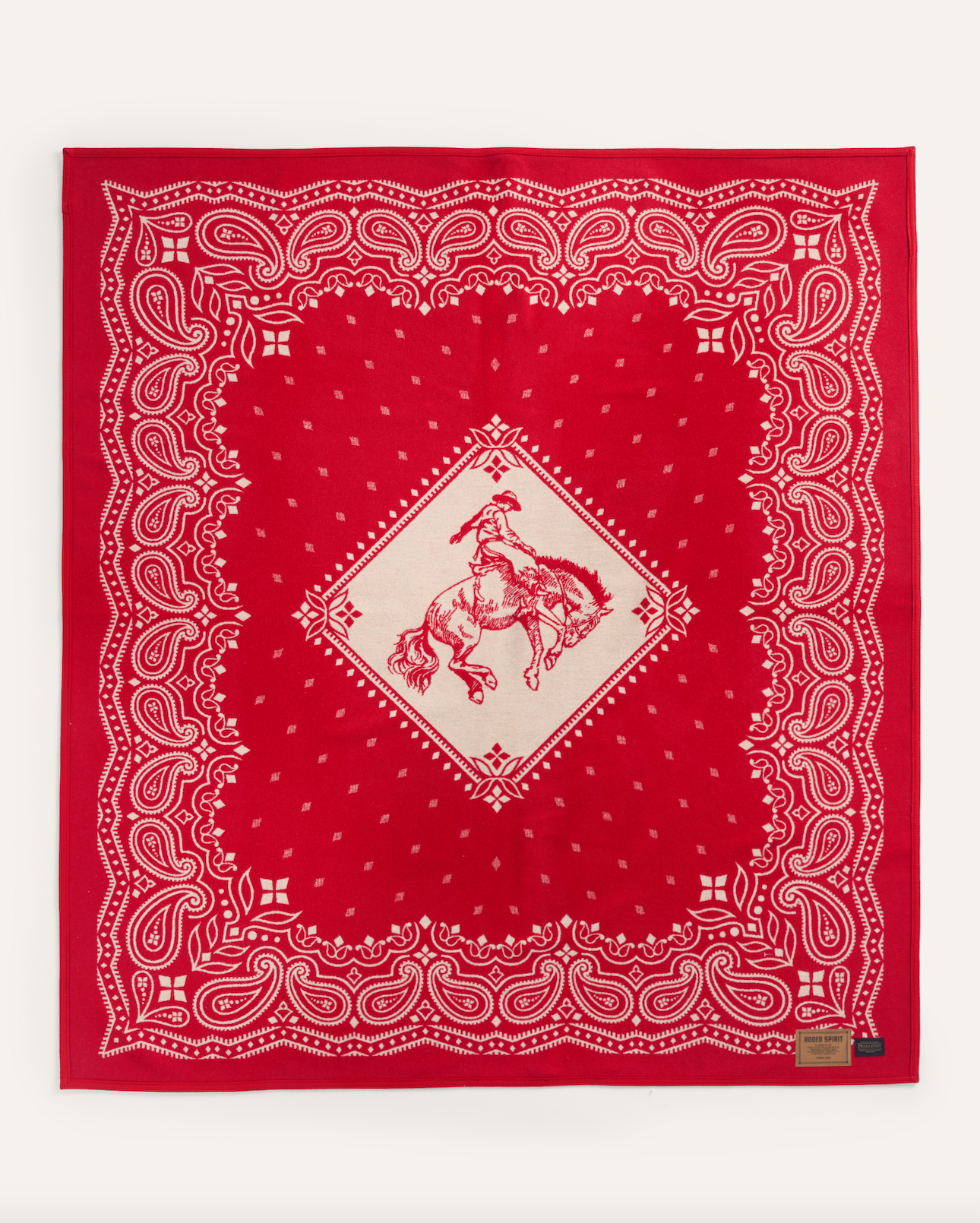 JACQUARD UNNAPPED THROW<br>RODEO SPIRIT RED