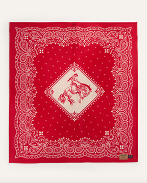 JACQUARD UNNAPPED THROW<br>RODEO SPIRIT RED