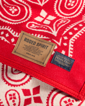 JACQUARD UNNAPPED THROW<br>RODEO SPIRIT RED
